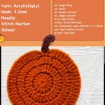 Orange crochet pumpkin coaster with a brown stem